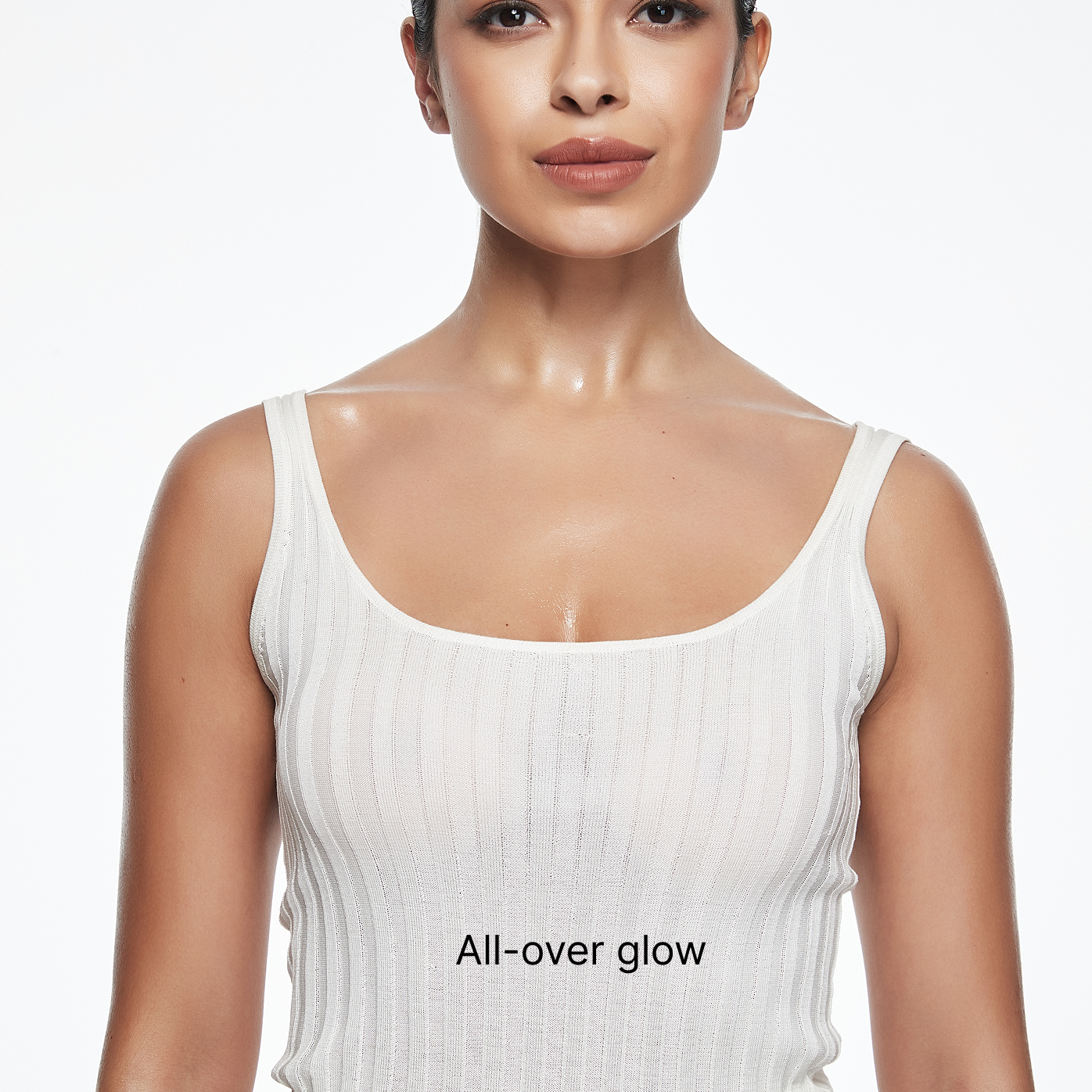 Model showcasing all-over glow effect with natural body makeup lotion for a radiant look.