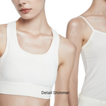 Close-up detail of fine shimmer effect on skin after applying body shimmer lotion, highlighting natural sheen on collarbone and shoulders.